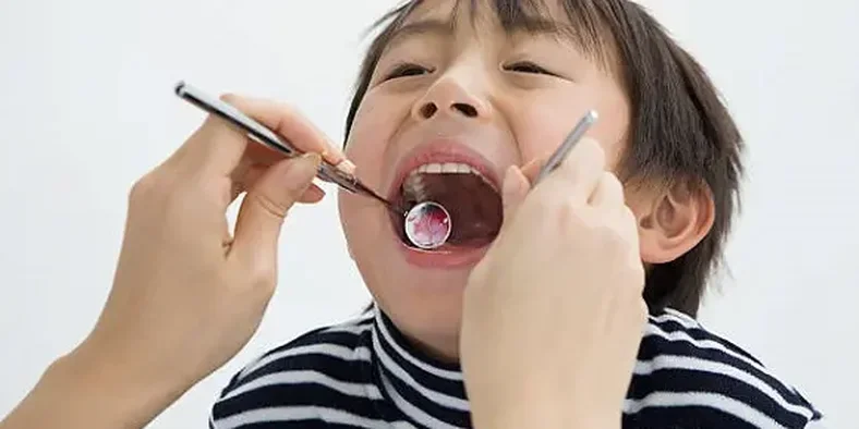 cara menghilangkan karang gigi