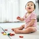 bayi 7 bulan bermain puzzle di playmat